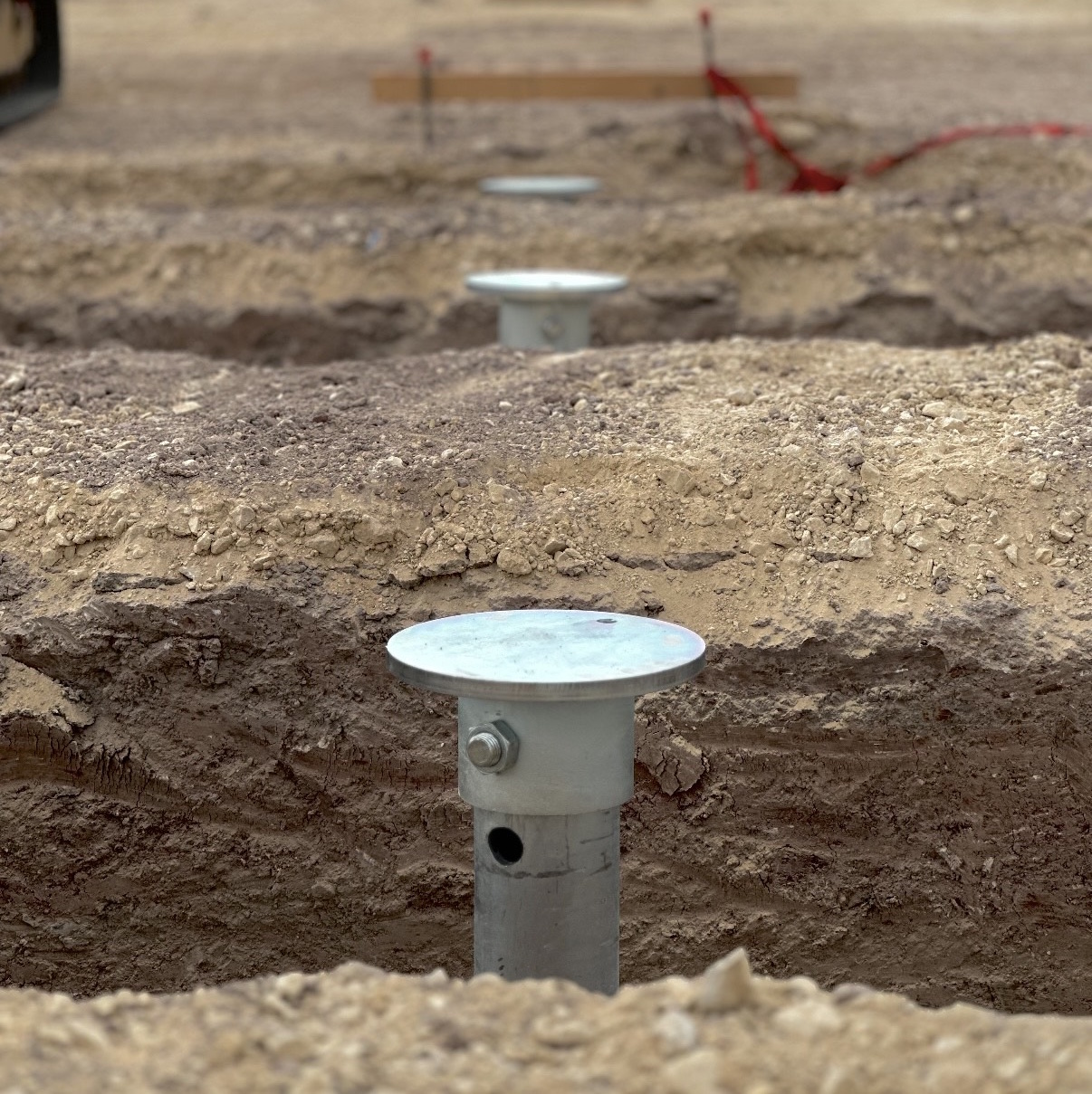 Helical pile installation on site